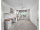 Bright office space with built-in desk, cabinets, and a large window for natural light at 1889 Union Pl, The Villages, FL 32162