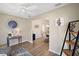 Open-concept home featuring a view of the dining room and entryway at 2055 Merideth Ter, The Villages, FL 34762