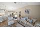 Spacious living room with vaulted ceilings, neutral walls, and ample natural light at 2055 Merideth Ter, The Villages, FL 34762