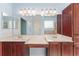 Double vanity bathroom with abundant storage and neutral finishes, offering style and function at 21312 Marsh View Ct, Clermont, FL 34715