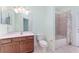A bathroom featuring a single vanity, toilet, and shower/tub combination at 21312 Marsh View Ct, Clermont, FL 34715