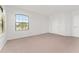 Bedroom with neutral carpeting, closet, and natural light offering a serene and inviting space at 21312 Marsh View Ct, Clermont, FL 34715