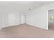 Bedroom with neutral carpeting and natural light, complemented by closet, creating a serene and inviting space at 21312 Marsh View Ct, Clermont, FL 34715