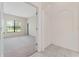 Bright bedroom featuring carpet floors, a large window, and a walk-in closet at 21312 Marsh View Ct, Clermont, FL 34715
