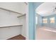 Spacious walk-in closet offers ample storage, with a view into the bedroom area at 21312 Marsh View Ct, Clermont, FL 34715