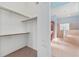Walk-in closet leads to a bathroom with a tub and walk-in shower at 21312 Marsh View Ct, Clermont, FL 34715