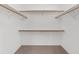 A walk-in closet featuring built-in shelving and carpet at 21312 Marsh View Ct, Clermont, FL 34715