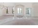 Spacious foyer with decorative tile flooring, a chandelier, and a view into the living spaces at 21312 Marsh View Ct, Clermont, FL 34715