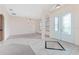 Open foyer with neutral tones, tile flooring, and an elegant chandelier at 21312 Marsh View Ct, Clermont, FL 34715