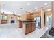 Open concept kitchen with stainless steel appliances, granite countertops, and a center island at 21312 Marsh View Ct, Clermont, FL 34715