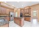 Bright kitchen features granite countertops, stainless steel appliances, and a central island at 21312 Marsh View Ct, Clermont, FL 34715