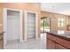 Gourmet kitchen featuring granite countertops, stainless steel appliances, and large pantry at 21312 Marsh View Ct, Clermont, FL 34715