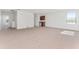 Expansive living room with neutral carpeting and a wet bar, perfect for entertaining or relaxing at 21312 Marsh View Ct, Clermont, FL 34715