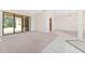 Open living room with tile accents and glass sliding doors leading to outdoor covered patio at 21312 Marsh View Ct, Clermont, FL 34715
