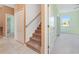 Staircase leading upstairs to the bedrooms with neutral carpeting at 21312 Marsh View Ct, Clermont, FL 34715