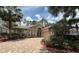Inviting exterior with a brick driveway, arched entrance, manicured landscaping and a two car garage at 2299 Twickingham Ct, Clermont, FL 34711