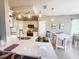 A bright kitchen features pendant lighting, light countertops, and stainless appliances at 2299 Twickingham Ct, Clermont, FL 34711