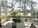 Screened lanai with view of backyard at 2299 Twickingham Ct, Clermont, FL 34711