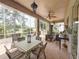 Spacious covered lanai with seating, dining, and outdoor kitchen for entertaining at 2299 Twickingham Ct, Clermont, FL 34711
