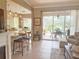 The living room offers seamless access to the outdoors, featuring tile floors and plenty of natural light at 2299 Twickingham Ct, Clermont, FL 34711
