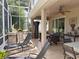 Beautiful covered patio with outdoor kitchen, pizza oven, grill, ceiling fan and tile flooring at 2299 Twickingham Ct, Clermont, FL 34711