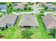 Aerial view of a well-maintained home with lush green lawn in a serene neighborhood at 26653 Otter Creek Ln, Leesburg, FL 34748