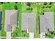 An aerial view that captures a home with a well-manicured lawn and landscaped backyard at 26653 Otter Creek Ln, Leesburg, FL 34748