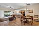 Open-concept living area seamlessly connected to the dining and kitchen spaces, ideal for entertaining at 26653 Otter Creek Ln, Leesburg, FL 34748