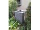 A modern air conditioner unit, surrounded by lush foliage, ensuring efficient climate control at 29205 Old E Ml, Tavares, FL 32778