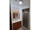Updated bathroom boasts an integrated shower and modern vanity with ample lighting at 29205 Old E Ml, Tavares, FL 32778
