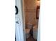 Compact bathroom features a toilet, sink, and neutral wall tiling at 29205 Old E Ml, Tavares, FL 32778
