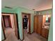 Comfortable bedroom featuring wood cabinets, a walk-in closet, and muted green walls at 29205 Old E Ml, Tavares, FL 32778