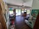 Florida room filled with natural light, views of the pool, and fun island décor at 29205 Old E Ml, Tavares, FL 32778