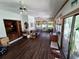 Large Florida room with access to the back yard, featuring a view into living room at 29205 Old E Ml, Tavares, FL 32778