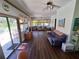 Spacious Florida room with ample seating and a view of the pool and outdoor area at 29205 Old E Ml, Tavares, FL 32778