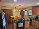 View of the kitchen island, dining table with chairs and back door at 29205 Old E Ml, Tavares, FL 32778