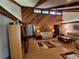 Bright living room featuring high vaulted ceilings, exposed beams, and a unique wood paneled wall at 29205 Old E Ml, Tavares, FL 32778