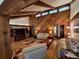 Spacious living room featuring high ceilings, a ceiling fan and wood paneled walls at 29205 Old E Ml, Tavares, FL 32778
