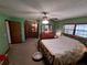 Spacious main bedroom with updated fixtures, a ceiling fan, and ample natural light at 29205 Old E Ml, Tavares, FL 32778