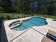Enclosed in-ground pool and spa offers ultimate relaxation and privacy at 29205 Old E Ml, Tavares, FL 32778