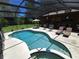 Backyard oasis featuring an in-ground pool and ample seating for relaxation at 29205 Old E Ml, Tavares, FL 32778