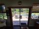 View of private pool and backyard area through decorative etched sliding glass doors at 29205 Old E Ml, Tavares, FL 32778