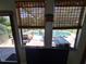 View of the pool from the window. Decorative glass is visible at 29205 Old E Ml, Tavares, FL 32778