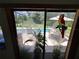 View of private pool and backyard area seen through decorated sliding glass doors at 29205 Old E Ml, Tavares, FL 32778