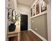 Stylish entryway featuring modern decor, wood-look floors, and a sleek mirror and console table at 295 Whirlaway Drive, Davenport, FL 33837