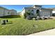 Well-manicured front yard with healthy grass, and tasteful landscaping enhancing curb appeal at 295 Whirlaway Drive, Davenport, FL 33837