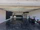 Spacious garage with ample storage and sleek epoxy flooring, perfect for organization and vehicles at 295 Whirlaway Drive, Davenport, FL 33837