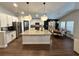 Modern kitchen with granite countertops, stainless steel appliances, and a center island at 295 Whirlaway Drive, Davenport, FL 33837