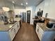 Well-equipped kitchen with granite counters, white cabinetry, and stainless steel appliances at 295 Whirlaway Drive, Davenport, FL 33837