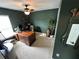 Inviting home office with rich wood desk, comfortable seating, and golf decor at 295 Whirlaway Drive, Davenport, FL 33837